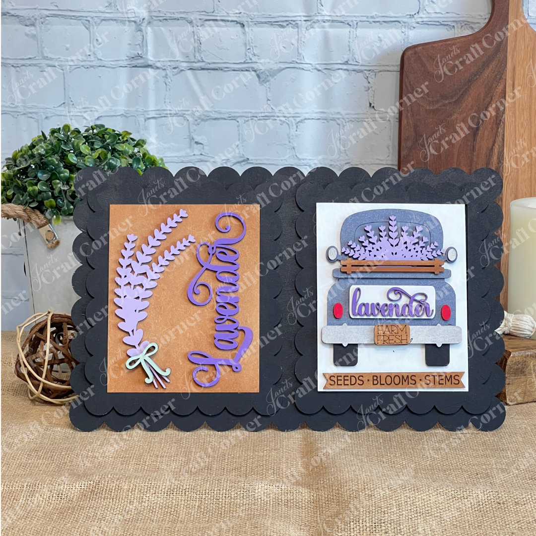 Janet's Craft Corner Lavender Switchable Farmhouse Signs DIY Craft Kit includes two scalloped black cards: one with a cutout lavender, dragonfly, and "lavender" text; the other with a truck of lavender and farmhouse sign wording.