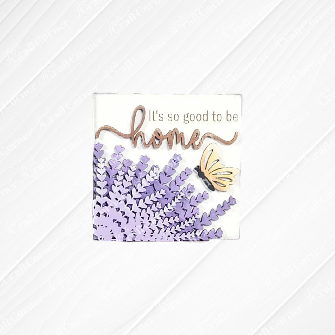 The Lavender Decor Set by Janet's Craft Corner features a mini sign with purple lavender flowers, a yellow butterfly, and "It's so good to be home" text—ideal for DIY home decor.
