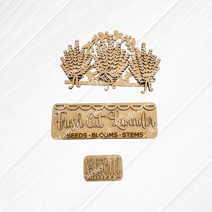 The Lavender Interchangeable Insert from Janet's Craft Corner includes laser-cut unfinished wood pieces—three lavender sprigs, a "Fresh Cut Lavender" sign, and a "BLOOM" rectangle—ideal for your DIY seasonal home decor craft kit.