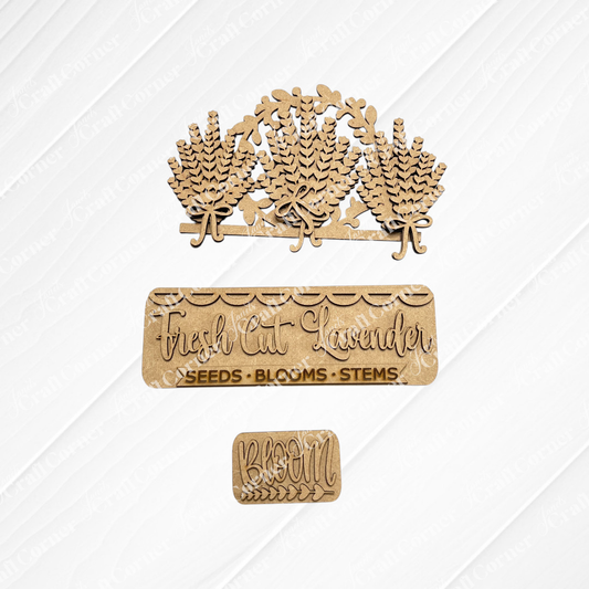 The Lavender Interchangeable Insert from Janet's Craft Corner includes laser-cut unfinished wood pieces—three lavender sprigs, a "Fresh Cut Lavender" sign, and a "BLOOM" rectangle—ideal for your DIY seasonal home decor craft kit.