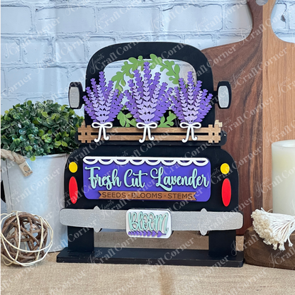 The Lavender Interchangeable Insert – DIY Craft Kit by Janet's Craft Corner features a decorative black truck with lavender bunches and a "Fresh Cut Lavender: Seeds • Blooms • Stems" sign, perfect for charming farmhouse-style home décor.