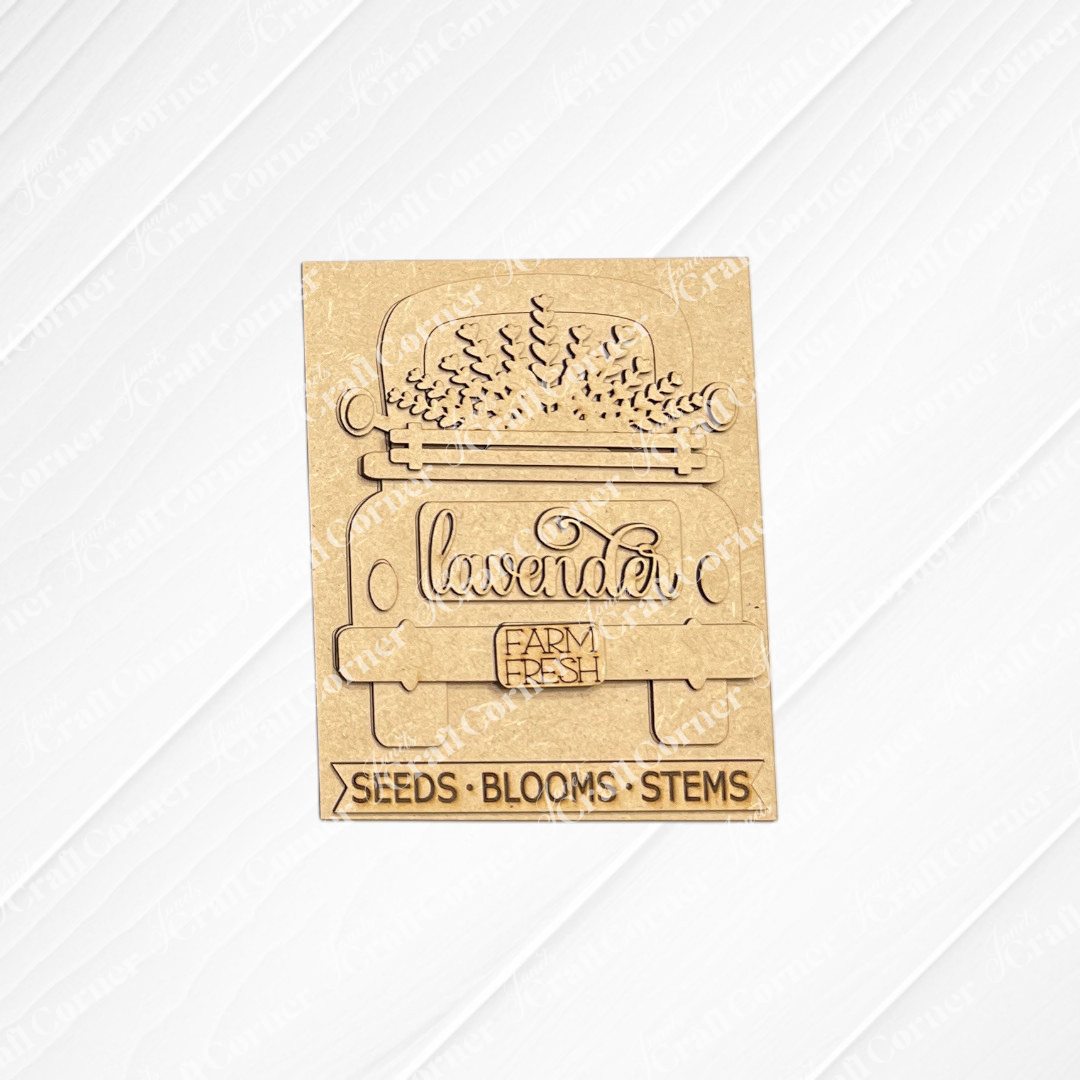 The Lavender Switchable Farmhouse Sign from Janet's Craft Corner is a DIY craft kit featuring a vintage truck with lavender, plus the engraved words “lavender,” “FARM FRESH,” and “SEEDS • BLOOMS • STEMS.” Perfect for tiered trays or small spaces.