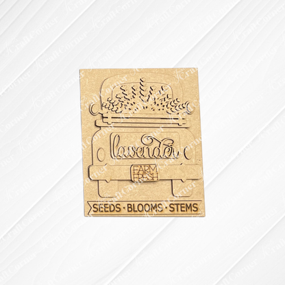 The Lavender Switchable Farmhouse Sign from Janet's Craft Corner is a DIY craft kit featuring a vintage truck with lavender, plus the engraved words “lavender,” “FARM FRESH,” and “SEEDS • BLOOMS • STEMS.” Perfect for tiered trays or small spaces.