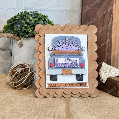 Janet's Craft Corner’s Lavender Switchable Farmhouse Signs DIY Craft Kit includes a scalloped brown frame and lavender sign with a vintage truck labeled "lavender farm fresh" and "SEEDS • BLOOMS • STEMS"—ideal for rustic tiered tray décor.