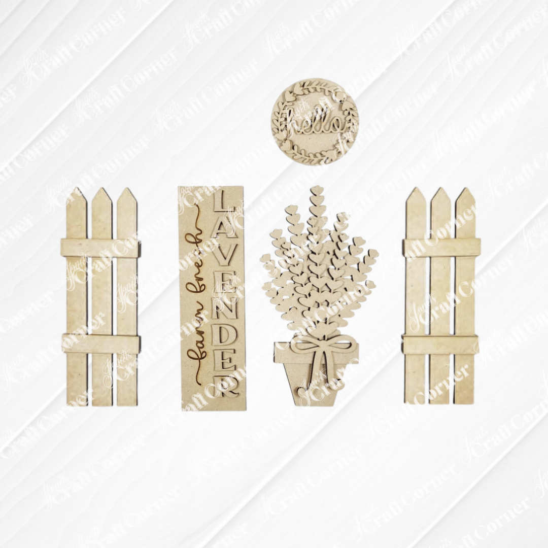 The Lavender Interchangeable Porch Set by Janet's Craft Corner includes five unfinished wood cutouts—two picket fences, a “Lavender” sign, a potted lavender plant, and a round “hello” sign—perfect for DIY seasonal home decor.