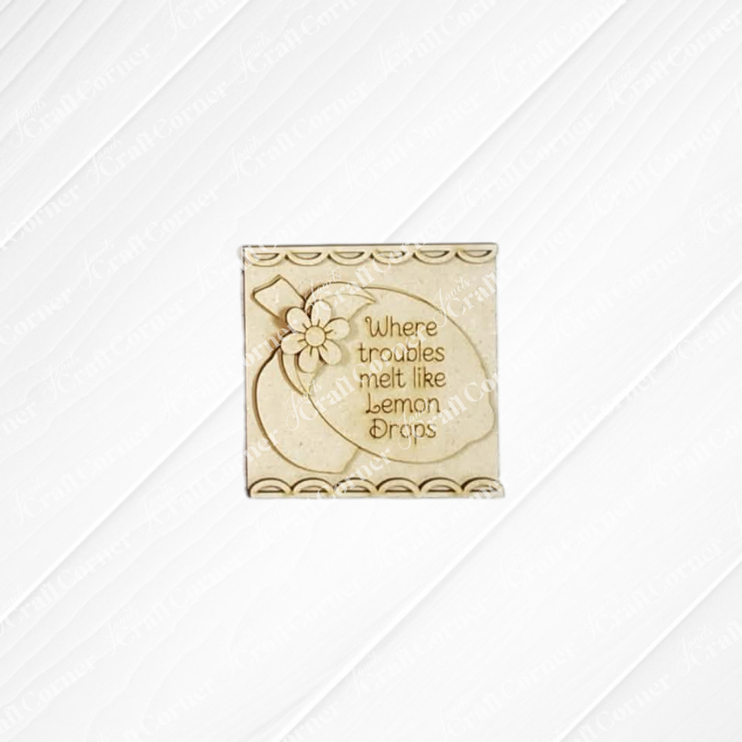 The Lemon Decor Set by Janet's Craft Corner features a square plaque with a flower and "Where troubles melt like lemon drops" engraving—ideal for DIY home decor and adding farmhouse charm.
