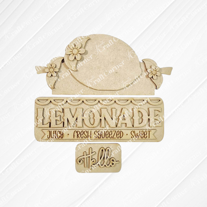 The Lemon Interchangeable Insert by Janet's Craft Corner is a 3-piece DIY seasonal home decor craft kit, featuring a lemon shape with flowers and fun lemonade-themed text—perfect for adding charm to your space.