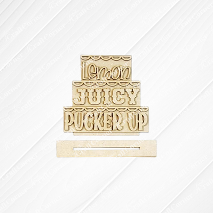 The Lemon Decor Set by Janet's Craft Corner features a three-layered wooden sign reading "Lemon JUICY PUCKER UP" in fun fonts, plus a separate rectangular piece—perfect for DIY farmhouse decor on any textured background.