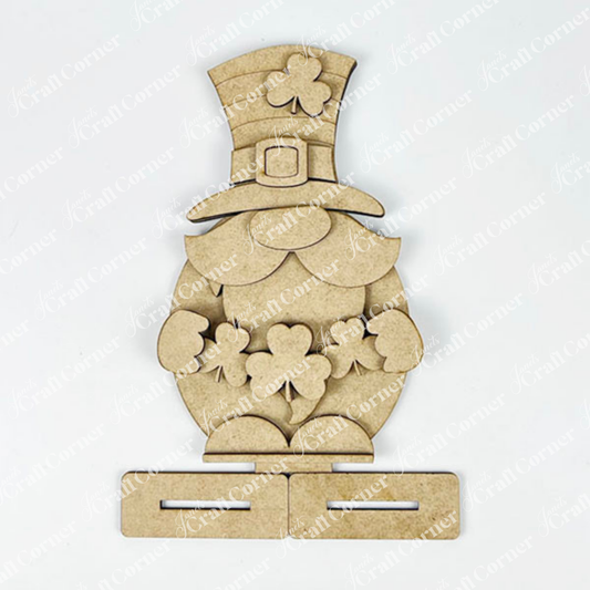 Discover the Leprechan Gnome Shelf Sitter DIY Kit from Janet's Craft Corner—a wooden cutout for seasonal home décor. It features a shamrock hat and charm cluster with slots for easy assembly, perfect for your next craft project!.