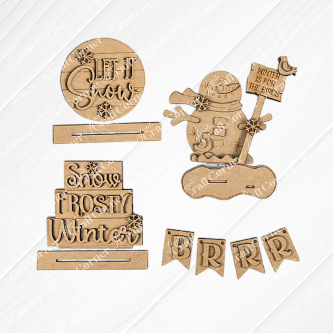 The Let It Snow Decor Set by Janet's Craft Corner is a winter-themed DIY home decor craft kit featuring 6 wooden pieces, including a snowman with a flag and snowflake motifs. With phrases like "Snow Frosty Winter" and "Let it Snow," they're perfect for your home or tiered tray displays and are easy to assemble.
