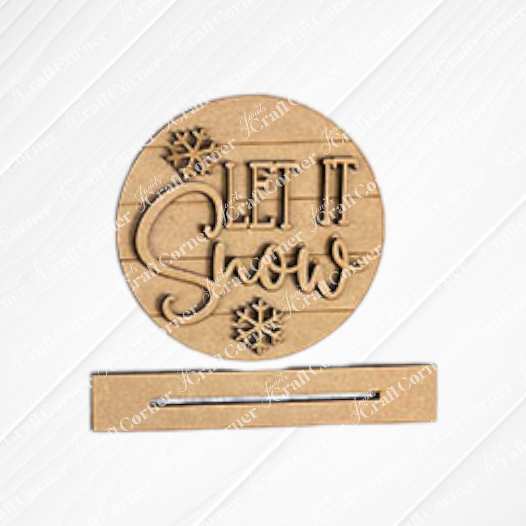 Create a festive atmosphere with the Let it Snow round from Janet's Craft Corner. This winter-themed display is shown on a white shiplap background. Use the DIY kit to add an enchanting touch to your winter décor.