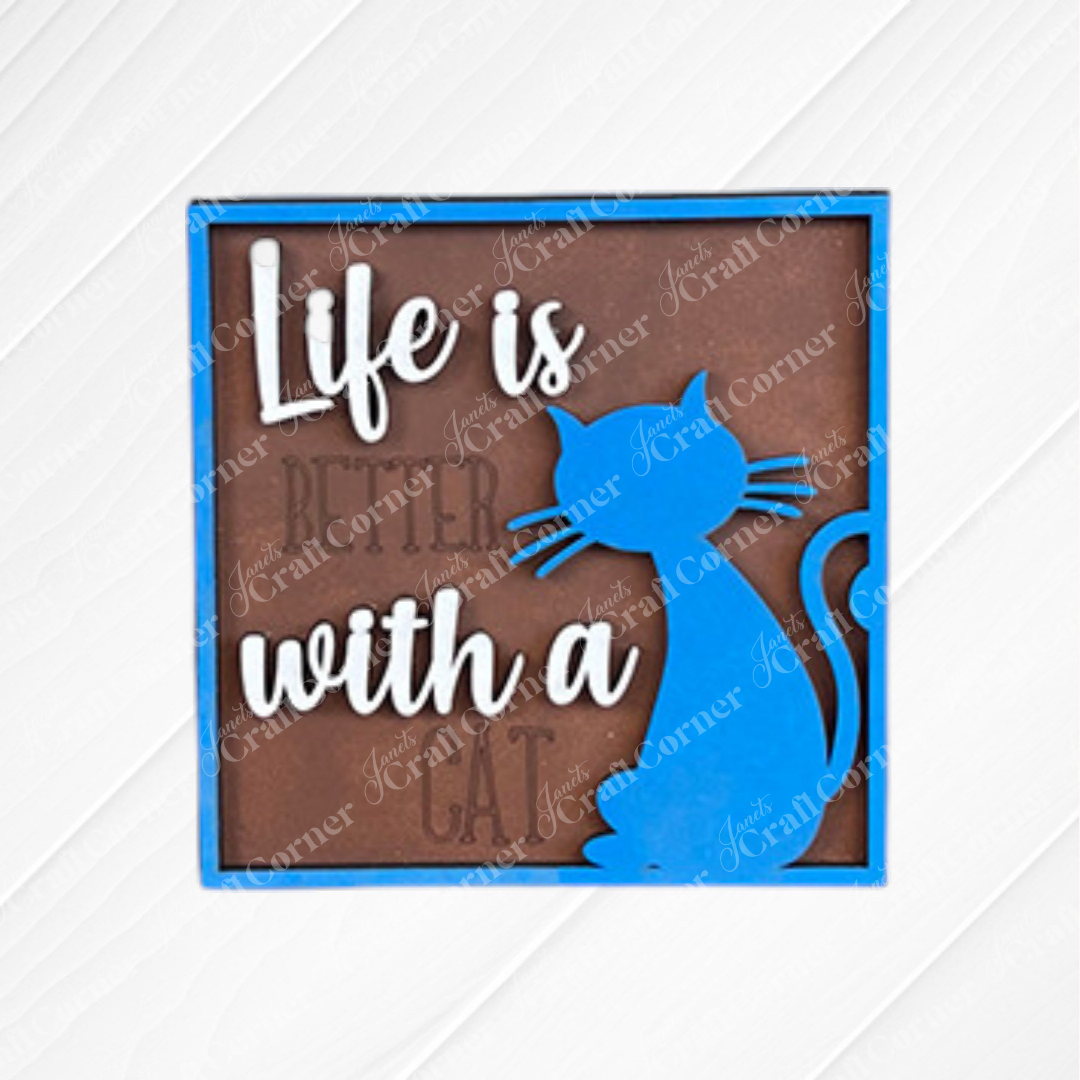 Janet's Craft Corner Cat Swappable Squares features a wooden sign with a blue cat silhouette, “Life is better with a cat”—perfect DIY rustic home decor.