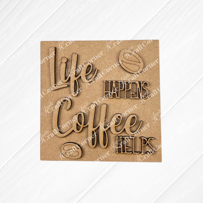 A wooden sign on a textured white background reads “Life happens, coffee helps,” surrounded by coffee bean designs—the perfect inspiration for your next Coffee Swappable Squares DIY kit from Janet's Craft Corner.