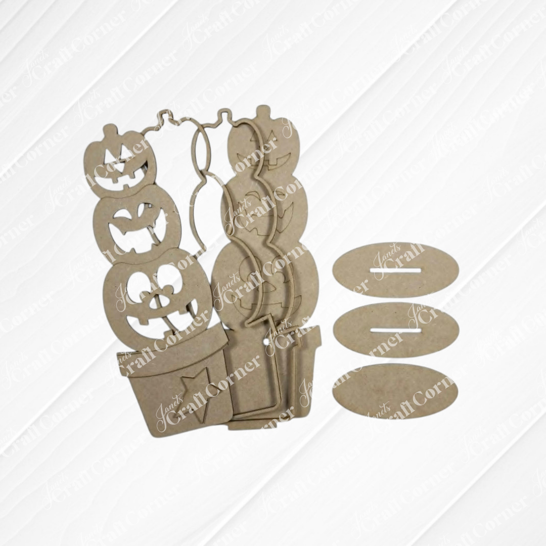 Laser-cut wooden pieces from Janet’s Craft Corner, featuring a Light-up Stacking Pumpkin Shelf Sitter DIY home decor craft kit (set of 1, available in two sizes), are displayed on a white textured background. Perfect for fall and Halloween accents, this kit offers an ideal project for crafting or assembly.