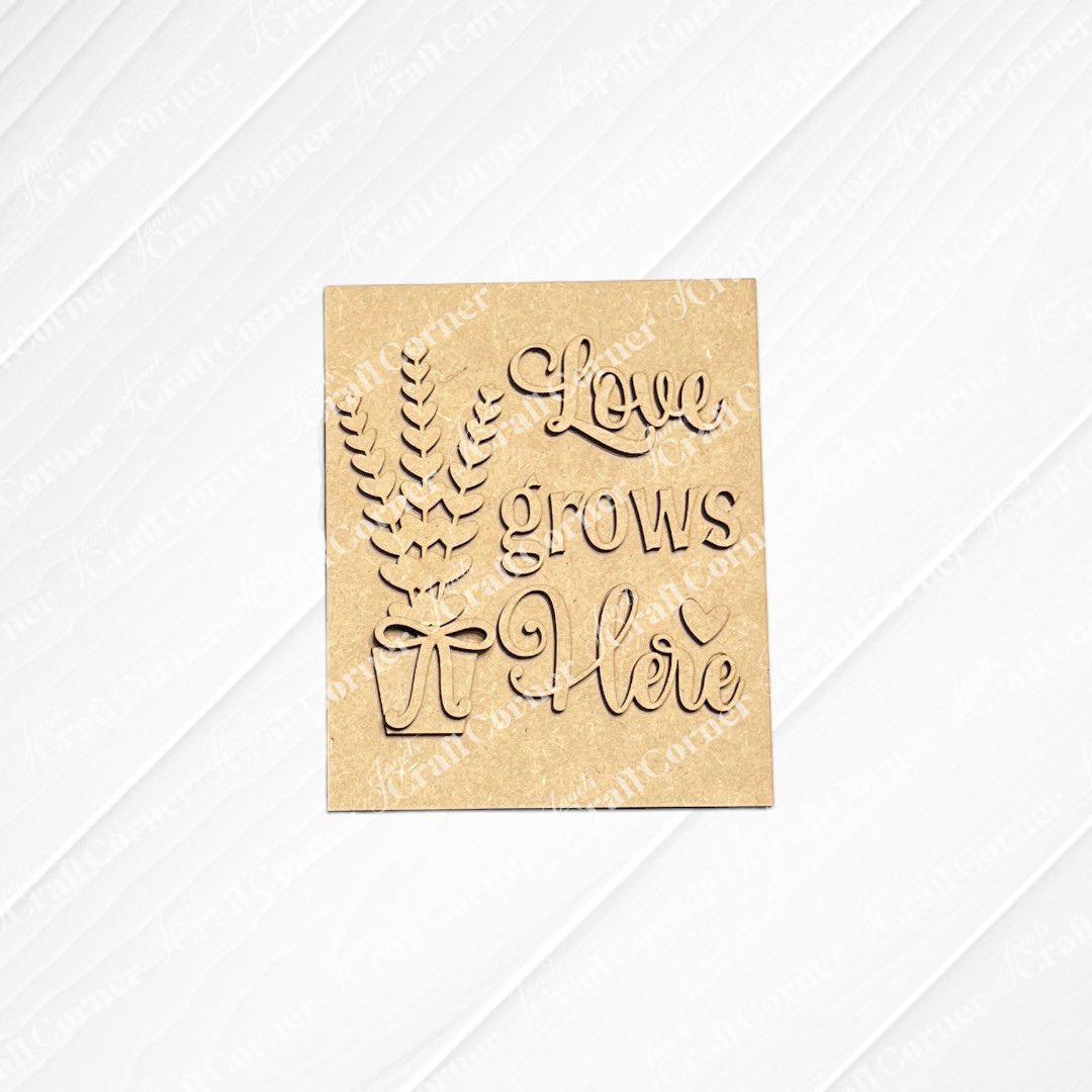Janet's Craft Corner offers the Lavender Switchable Farmhouse Signs DIY craft kit—a wooden sign featuring leafy branches in a pot and "Love grows here," perfect for small spaces or tiered trays. Set of 1.