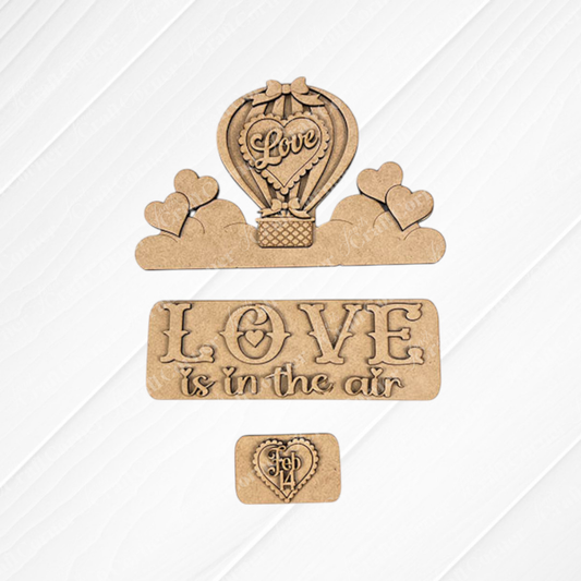 Transform your space with Janet's Craft Corner's "Love is in the Air Interchangeable Insert" DIY home decor kit. This charming set includes wooden craft pieces on textured burlap, showcasing a hot air balloon adorned with "Love," hearts floating on clouds, and the phrase "LOVE is in the air." It's an ideal hand-painted DIY craft kit to bring creativity and charm to your February 14 celebrations.
