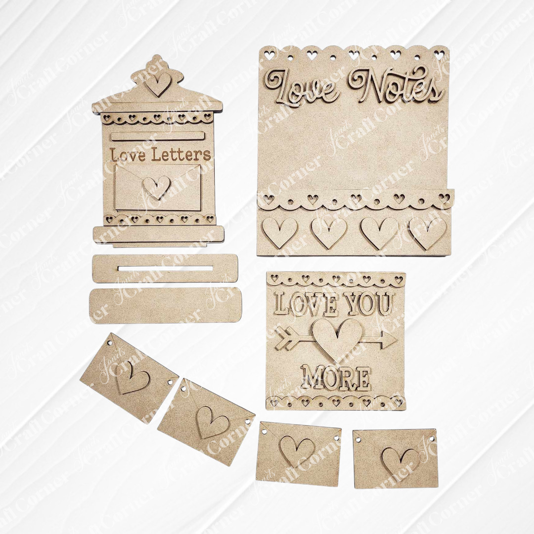 Explore Janet's Craft Corner's Valentine Love Letters Decor Set, ideal for home décor. This DIY craft kit includes delightful elements like a mailbox shape, small hearts, and hanging banners with designs such as "Love Notes" and "Love You More" to personalize your space.