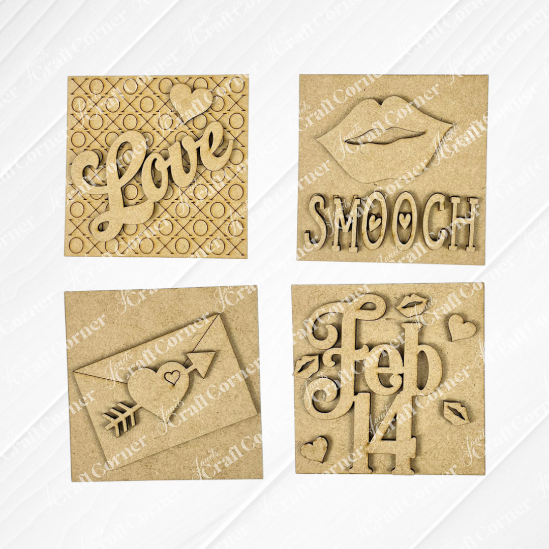 Janet's Craft Corner Love Squares: four wooden plaques with Valentine's cut-out designs—"Love" with a heart, lips with "Smooch," a love letter, and "feb 14." Perfect for seasonal decor or as a DIY craft kit.