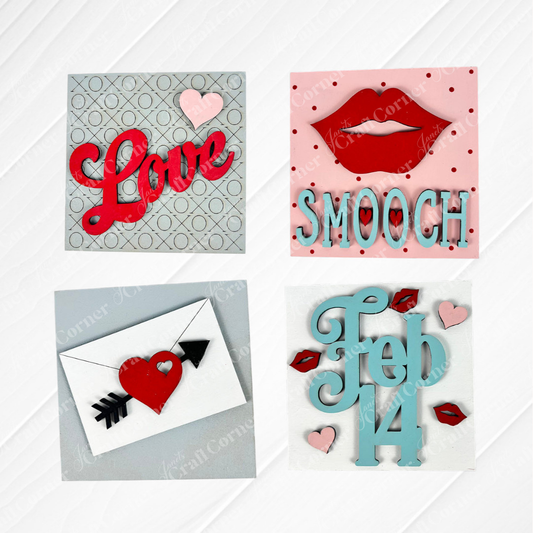 Janet's Craft Corner's Love Squares: four Valentine’s Day cards for Swappable Square Displays—“Love” with a heart, “Smooch” with lips, a heart-arrow envelope, and “Feb 14”—ideal for DIY craft kits or seasonal decor.