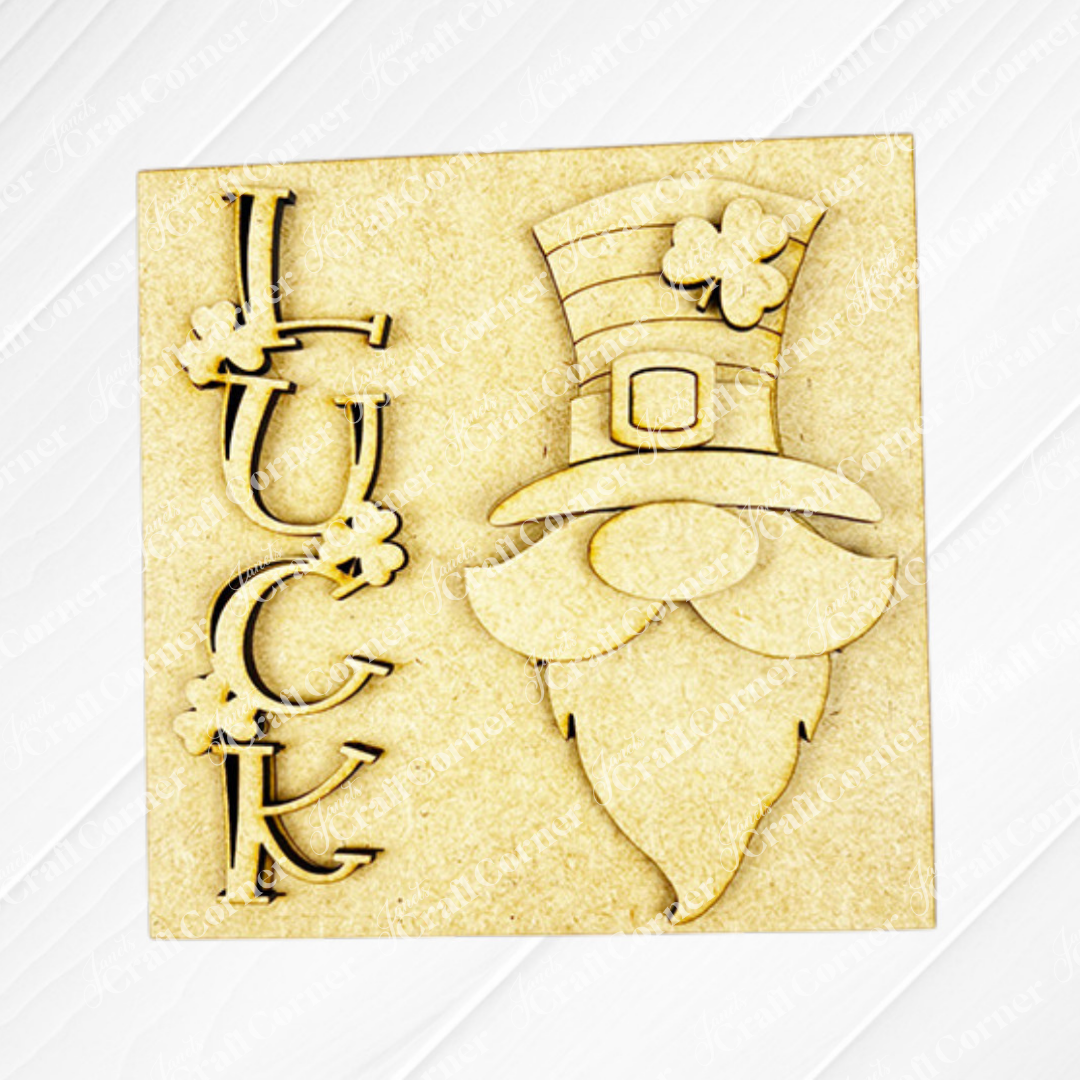 Janet's Craft Corner's Lucky Irish Squares is a light wood-colored plaque with "LUCK," clovers, and a leprechaun—ideal for tiered tray decor with festive wood cut-outs and charming St. Patrick’s Day details.