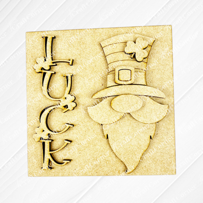 Janet's Craft Corner's Lucky Irish Squares is a light wood-colored plaque with "LUCK," clovers, and a leprechaun—ideal for tiered tray decor with festive wood cut-outs and charming St. Patrick’s Day details.