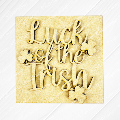 The Lucky Irish Squares by Janet's Craft Corner feature "Luck of the Irish" in cursive with three shamrock cut-outs on a light, textured background—perfect for tiered tray decor or Swappable Squares.