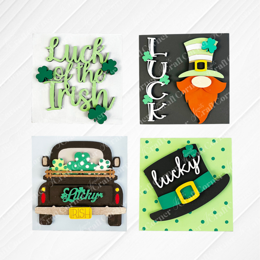 Janet's Craft Corner Lucky Irish Squares features four St. Patrick's Day wood cutouts: "Luck of the Irish" with shamrocks, "LUCK" with leprechaun, a truck with shamrocks sign, and a leprechaun hat—perfect for tiered trays.