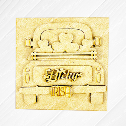Janet's Craft Corner presents Lucky Irish Squares—a wooden cutout of a vintage truck with shamrocks, "Lucky" on the tailgate, and "Irish" on the license plate. Perfect tiered tray decor for St. Patrick’s Day on a light textured background.