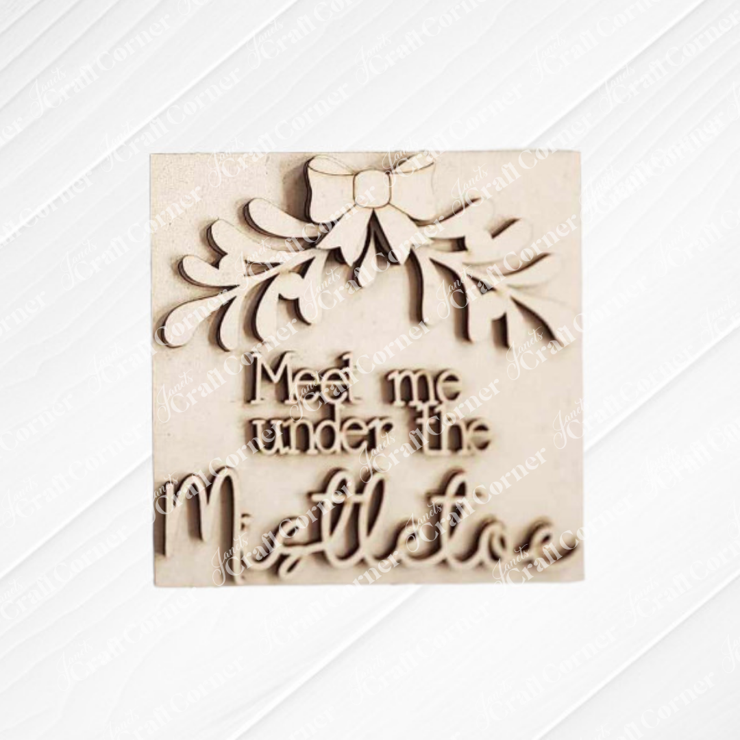 The Mistletoe Swappable Squares DIY kit by Janet's Craft Corner features festive wood pieces with bows and leaves, ideal for tiered trays or mixing with other cut-outs for seasonal home decor. Choose from 4 designs.