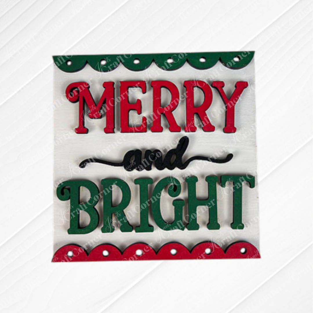The Merry Christmas Squares by Janet's Craft Corner features "Merry and Bright" in red and green on white, bordered with festive patterns—ideal for DIY seasonal décor or Swappable Square Displays.