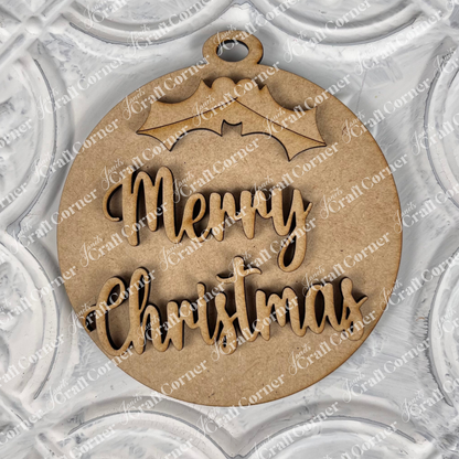 A "Round Christmas Ornament" from Janet's Craft Corner's DIY Decoration Kits complements your home décor when placed elegantly on a decorative white textured surface. Featuring a charming holly design at the top, this ornament adds a festive touch to any setting with its "Merry Christmas" text.