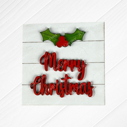 Janet's Craft Corner Merry Christmas Squares: a white wooden sign with red cursive "Merry Christmas", topped with green holly and berries. Perfect DIY seasonal decor for tiered tray signs or swappable square displays.