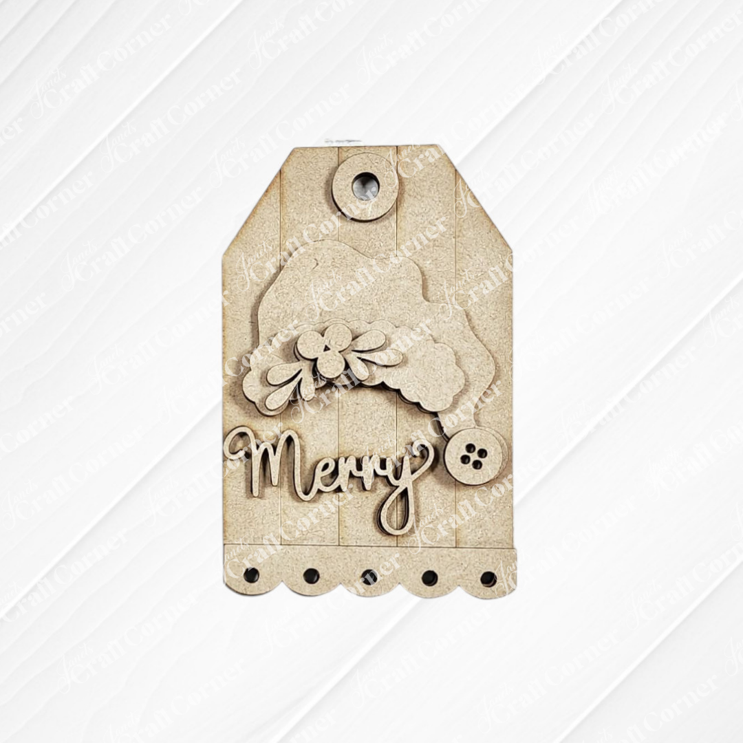 Add a festive finishing touch to your holiday gifts with this brown gift tag featuring a scalloped edge, cupcake and flower accents, a button, and “Merry” in elegant script on a textured background—perfect for pairing with Janet’s Craft Corner’s Jolly St. Nick Ornaments DIY holiday craft kit (choice of 3) or your favorite handmade wood cut-out ornaments.