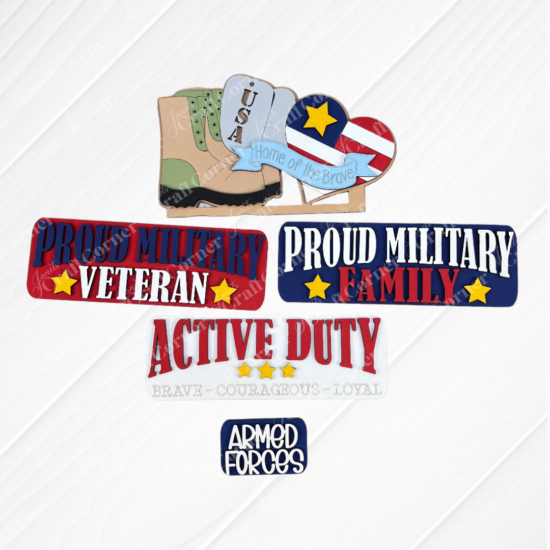 Showcasing military-themed crafts on a burlap background, this DIY home decor kit includes an interchangeable display that features a USA sign with a boot and the text "Home of the Brave." Created by Janet's Craft Corner, this hand-painted Military Interchangeable Insert also has badges reading "Proud Military Veteran" and "Proud Military Family.