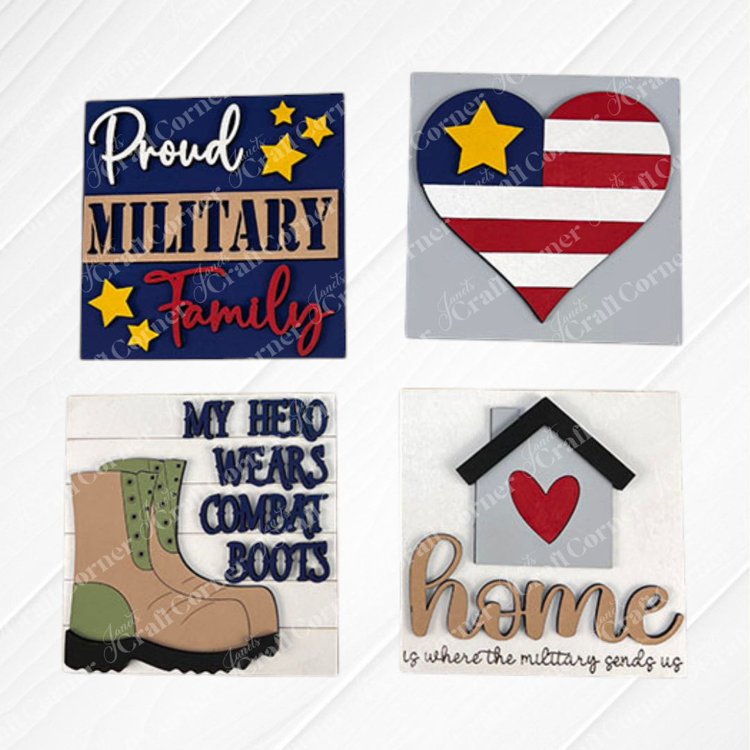 Military Squares by Janet's Craft Corner features four swappable tiles: "Proud Military Family" with stars, a flag heart, boots with "My Hero Wears Combat Boots," and "Home is where the military sends us"—perfect tiered tray decor!.