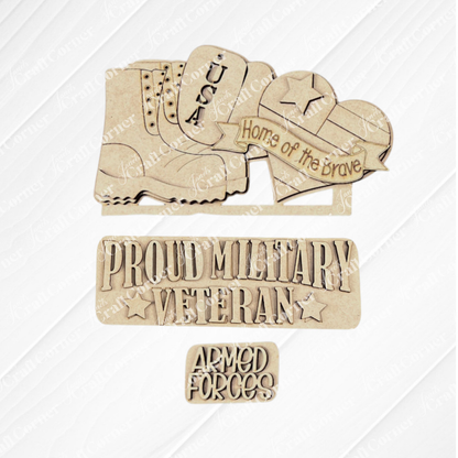 The Military Interchangeable Insert DIY home decor kit from Janet's Craft Corner features wooden cutouts on a burlap background, showcasing military-themed designs such as a boot with "USA," a heart reading "Home of the Brave," and text proclaiming "Proud Military Veteran" and "Armed Forces." Each element is designed to be interchangeable, resting elegantly on a white textured square.