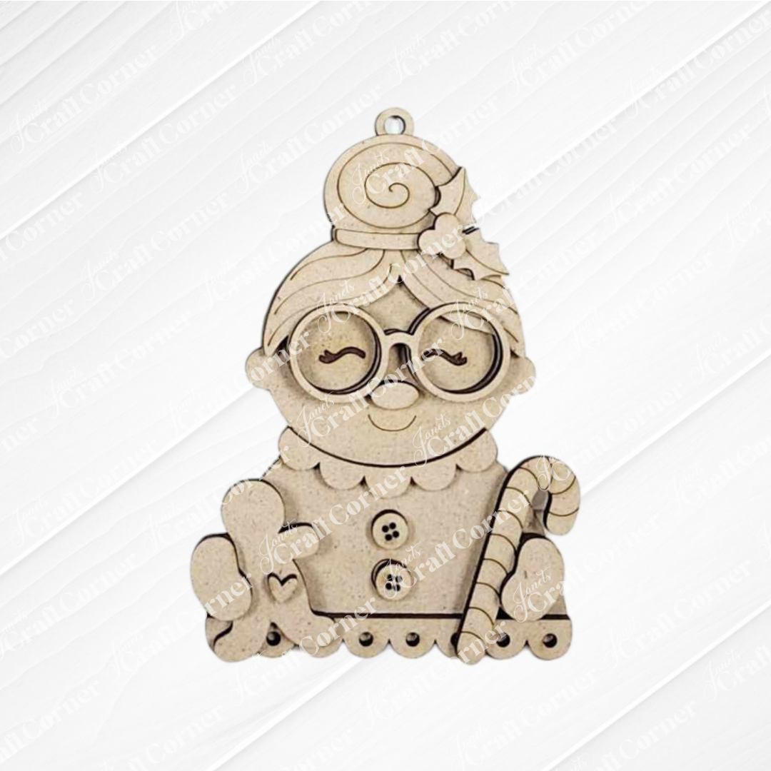 Janet's Craft Corner Mrs. Claus Ornaments feature a smiling Mrs. Claus with glasses, bun, holly, holding a gingerbread cookie and candy cane—ideal for festive decor or adding to your Santa Ornaments collection.