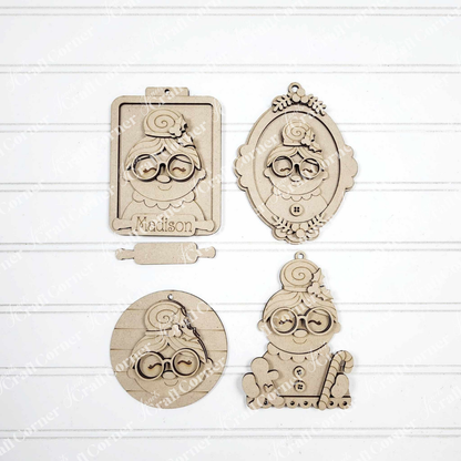 Set of four Mrs. Claus Ornaments from Janet's Craft Corner, each with glasses and a bun in assorted shapes (clipboard, oval frame, circle, candy cane stand). Ideal for festive decor or DIY crafts. One ornament labeled "Madison.