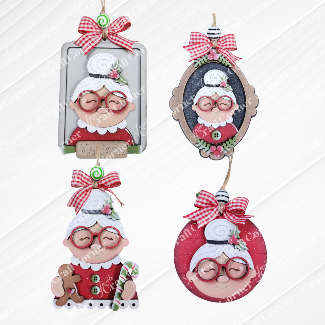 Janet's Craft Corner Mrs. Claus Ornaments: Set of four festive ornaments featuring a cheerful elderly woman with glasses and a white bun, plaid bows, and holiday accents—perfect for your DIY holiday craft kit.
