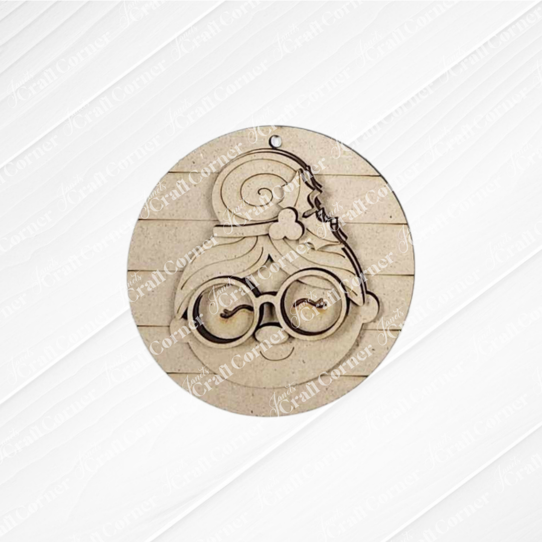 The Mrs. Claus Ornaments by Janet's Craft Corner feature a round wooden design with layered details—perfect for festive decorations or as a unique DIY holiday craft kit.