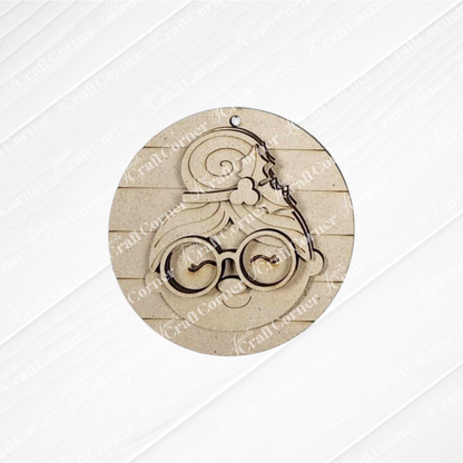 The Mrs. Claus Ornaments by Janet's Craft Corner feature a round wooden design with layered details—perfect for festive decorations or as a unique DIY holiday craft kit.