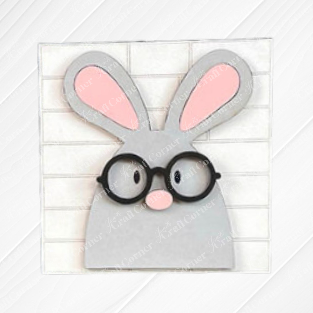 Easter Bunny Squares by Janet's Craft Corner feature a minimalist gray bunny with pink ears and round black glasses on a white tiled background—ideal for tiered tray decor or your Swappable Squares wood cut-outs collection.