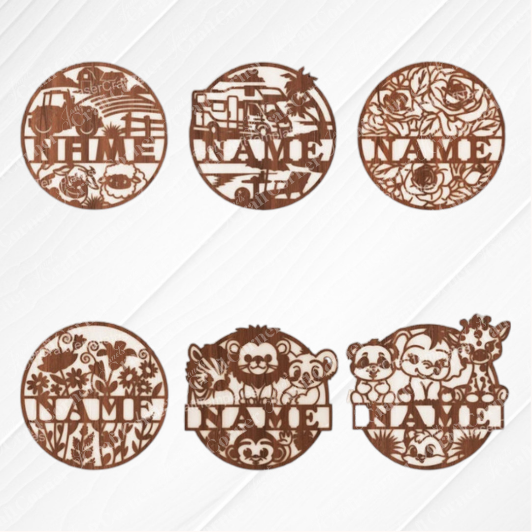 Janet's Craft Corner Nursery Name Wall Hanger set includes six unfinished round wood plaques in truck, bulldozer, floral, wildflowers, woodland, and zoo animal designs. Each has a customizable "NAME" space—ideal for DIY nursery decor.