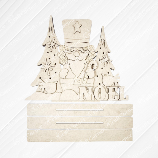 Bring festive cheer to your home with the Nutcracker Light-Up Shelf Sitter DIY craft kit from Janet’s Craft Corner. This unfinished wooden decor features a nutcracker standing between two Christmas trees, with gifts and the word “NOEL” displayed in front. Just like other creative holiday decorations, it comes ready for painting or embellishing and includes three blank slots at the bottom—perfect for adding your own personalized touches.