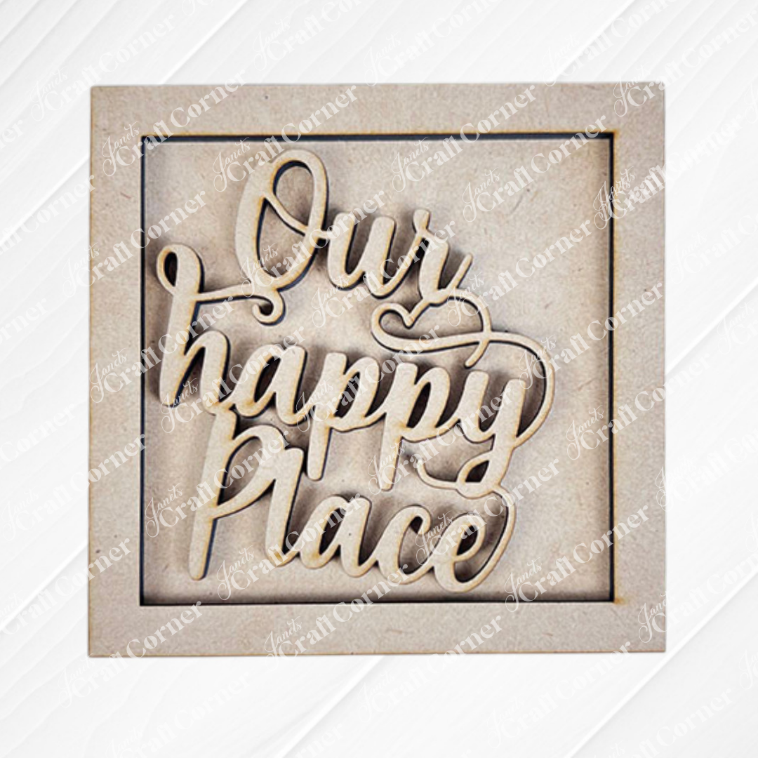 Home Squares by Janet's Craft Corner: A wooden sign with cut-out cursive "Our happy place" inside a square frame, ideal for tiered tray decor, set against a light textured background.