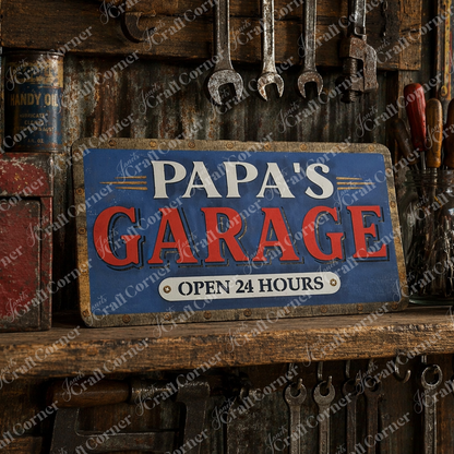 Janet's Craft Corner’s Personalized Garage Shelf Leaner DIY kit displays "Papa's Garage, Open 24 Hours" in blue, red, and white—perfect for adding vintage charm to your home workshop or customized garage shelf decor.