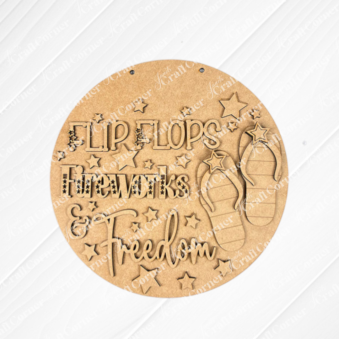The Flip Flops Fireworks Freedom Sign – DIY Craft Kit by Janet's Craft Corner features engraved flip flops, stars, and festive text on a light wood background—perfect 4th of July décor for your home.