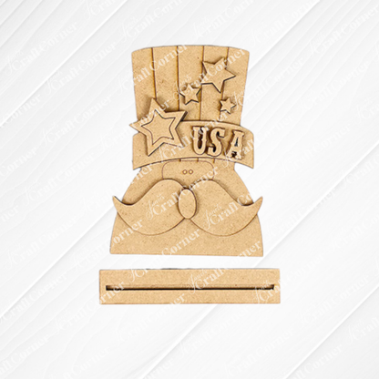 Janet's Craft Corner Patriotic Mini Shelf Sitters – DIY Craft Kit features a mustache and Uncle Sam hat with stars and "USA," plus a slot below for signs or cards—ideal for Americana décor or personalized wood crafts.