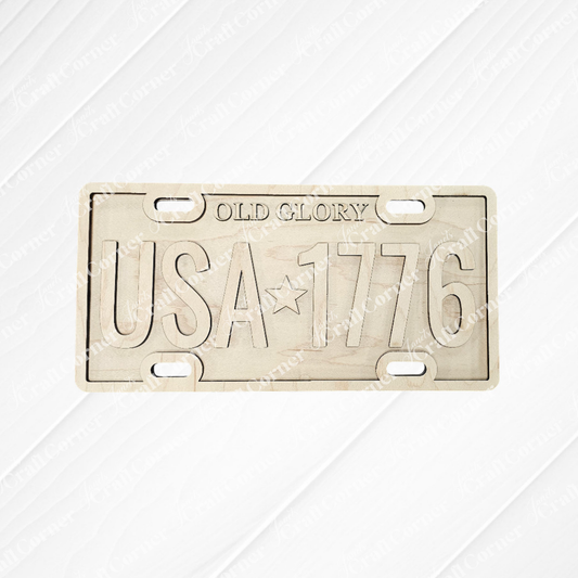 The Old Glory License Plate Shelf Leaner from Janet's Craft Corner is a DIY home decor craft kit featuring "OLD GLORY" and "USA ★ 1776" on a metal plate—perfect for adding farmhouse flair or as a creative project for your space.