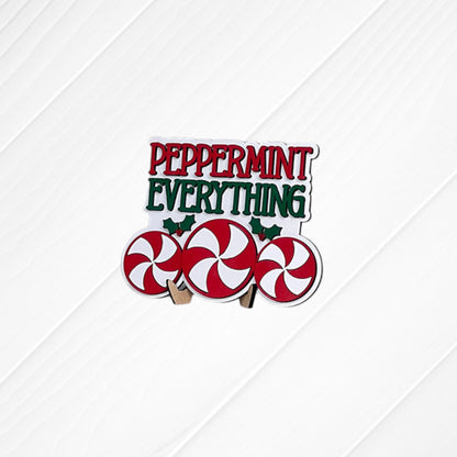 Heartland Peppermint Mocha Mini Shelf Sitters – Painted: Features the words “Peppermint Everything” above three red and white peppermint candies, accented with small green holly leaves on a white wood background—ideal for adding a festive touch to your Peppermint Mocha decor or including in your DIY home decor kit.